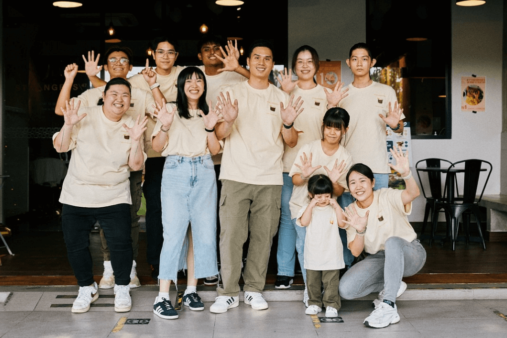 Strangers at 47 team waving